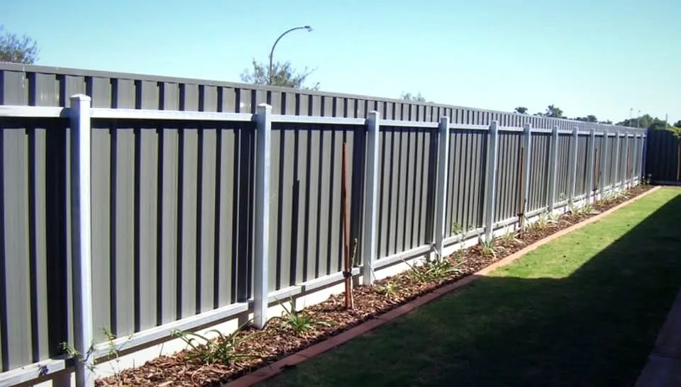 Colorbond slat boundary fence along a landscaped Adelaide backyard
