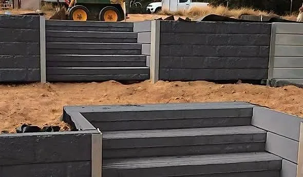Charcoal concrete sleeper retaining wall and garden bed